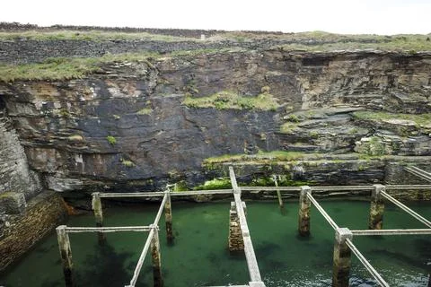 Old natural pool for breeding shellfish in Rinlo town, a small fishing vill.. Stock Photos