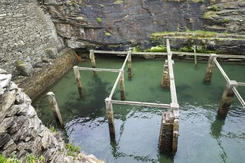 Old natural pool for breeding shellfish in Rinlo town, a small fishing vill.. Stock Photos