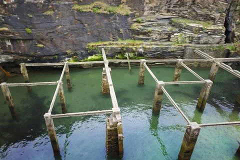 Old natural pool for breeding shellfish in Rinlo town, a small fishing vill.. Stock Photos