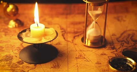 Old nautical navigation items with candle on vintage map Stock Footage 104089284