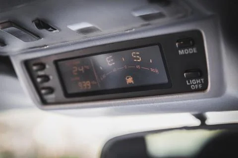 Old navigation system with compass in SUV car Stock Photos
