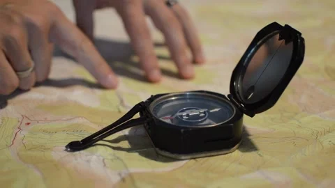 Old navigation travel compass on a map. compass used for exploration Video stock 196922683
