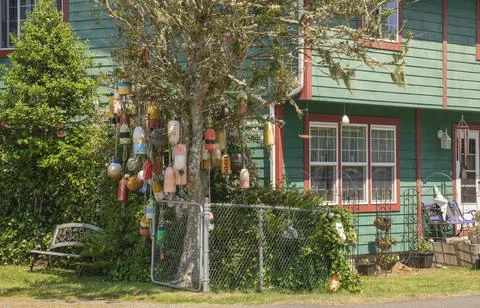 Old netting floats decorating a tree near Long beach Washington. Stock Photos