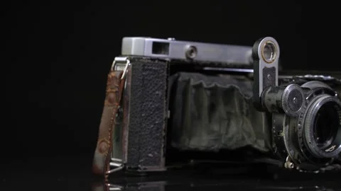 Old non-working photo camera in the open state. Dolly shot Stock-Footage 244938125