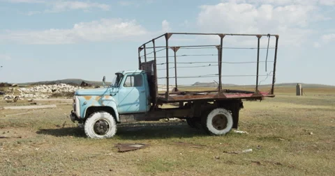 Old non-working soviet truck in the middle of the Kazakh steppe Stock Footage 141785065
