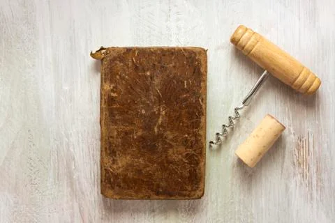 Old notebook, corkscrew, and cork, with copyspace 写真素材