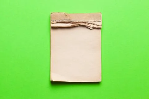 Old notebook on green background Stock Photos