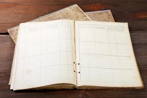 Old office notebook on vintage table Stock Photos