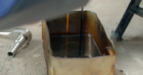Old oil drained from the engine.Old oil is black and very viscous. Stock Footage 289855308