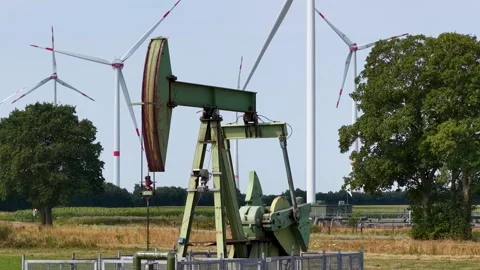 Old Oil Pumpjacks and Wind Turbines Stock Footage 342792862