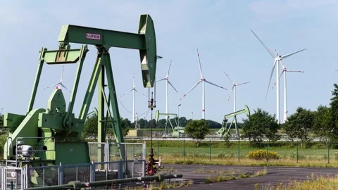 Old Oil Pumpjacks and Wind Turbines Stock Footage 342792871