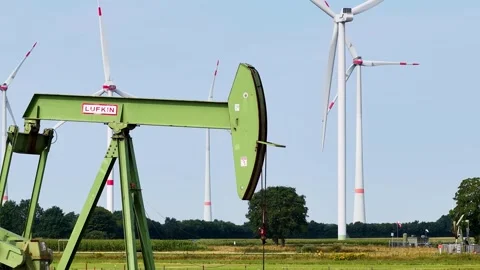 Old Oil Pumpjacks and Wind Turbines Stock Footage 342792875