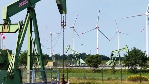 Old Oil Pumpjacks and Wind Turbines Stock Footage 342792878