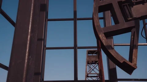 The old oil rig is working, extracting oil.pumping unit and the silhouette .. Stock Footage 232606185