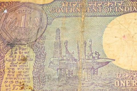 Old One Rupee notes combined on the table, India money on the rotating table. Stock Photos