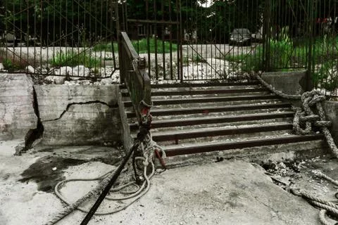 An old open outer stone staircase. Stone, cement steps of the old staircase w Stock Photos