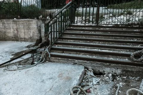 An old open outer stone staircase. Stone, cement steps of the old staircase w Stock Photos