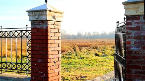 Old openwork gate in the garden closes with Stock Footage 106352557