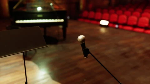 Old opera stage set with piano and mic for upcoming performance Stock Footage 331399472