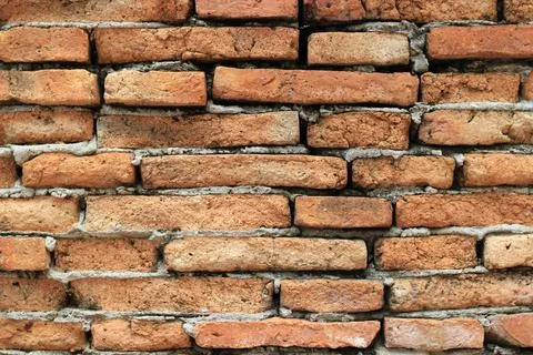 Old orange block brick wall backgrounds textures. Stock Photos