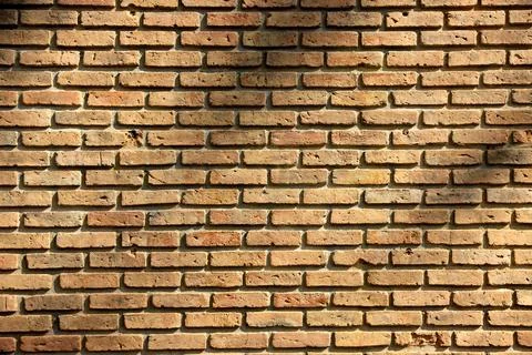 Old orange block brick wall backgrounds textures. Stock Photos