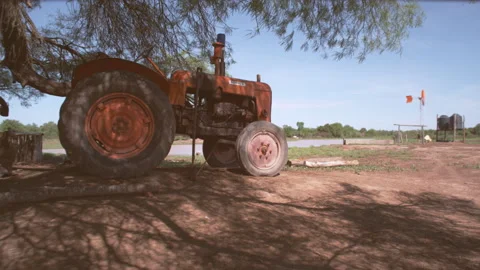 Old orange  tractor on the farm Stock Footage 137606387