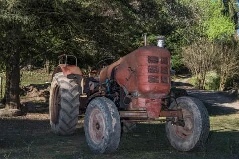 Old orange tractor Foto stock