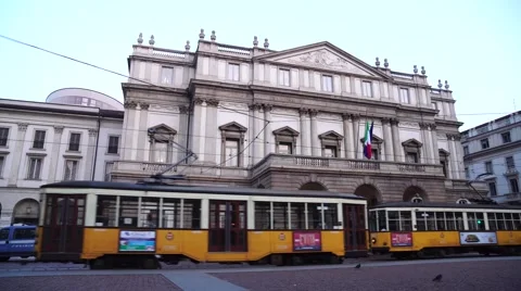 Old orange trams in front of the Scala Theatre Video stock 68823815
