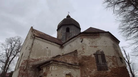 An old orthodox  bricks abandoned church in the middle of the forest Stock Footage 253223799