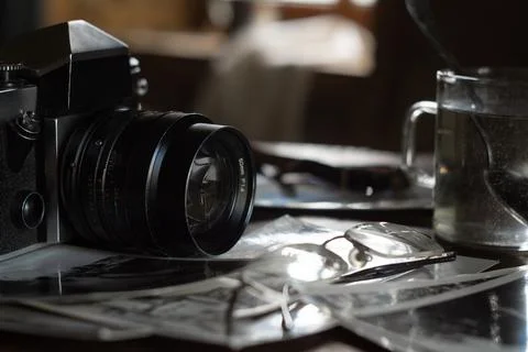 Old outdated camera and black and white photo Stock Photos