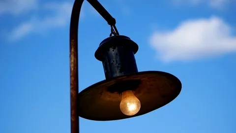 An old outside lamp swinging Stock Footage 125971898