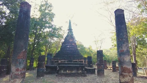 Old overgrown buddhist temple in the forrest near Wat Maha That. Sukhothai Stock Footage 341148491