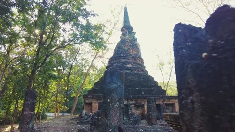 Old overgrown buddhist temple in the forrest near Wat Maha That. Stock Footage 341150809