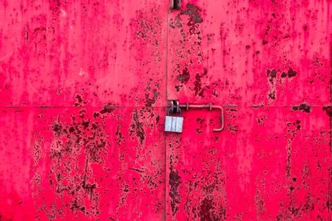Old padlock on the iron red texture Photos