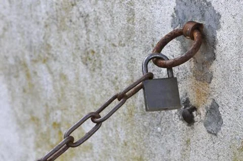 Old padlock on a rusted chain Stock Photos