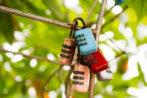 Old padlocks numbers code engraved with the names of lovers Lovers person sho Stock Photos