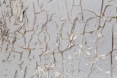 Old paint background. Texture and pattern of peeling dried old paint on the w Stock Photos