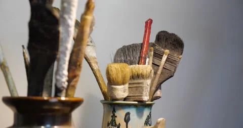 Old paint brushes in a jar Stock Footage 234282727