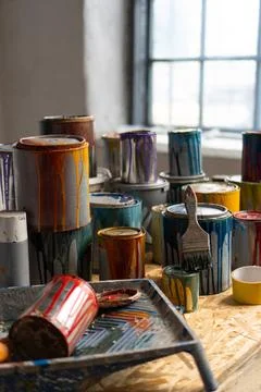 Old Paint Cans. Cans of colored paint. Oil-based enamel, lacquer, shellac and Stock Photos