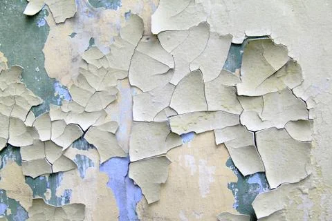 Old paint peeling from wall close up Stock Photos