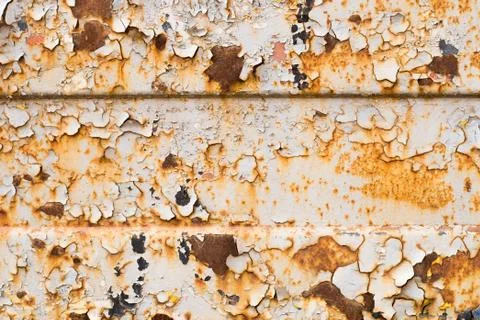 Old paint on a rusty iron sheet Stock Photos