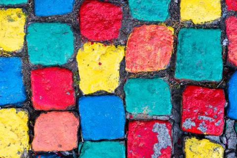 Old painted cobblestone background with grass Stock Photos