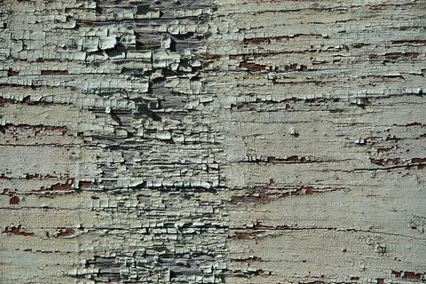 Old painted tree wall board blue gray pattern. cracked and scratched. close up Stock Photos