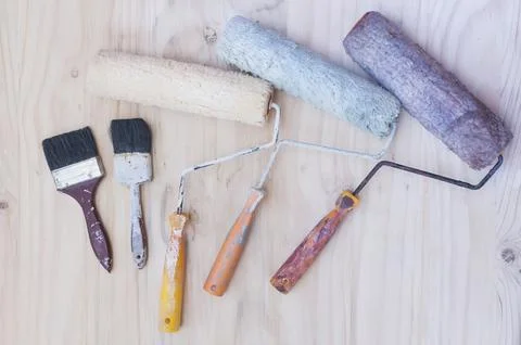 Old painter brush set, hand tool, over white wooden background Stock Photos