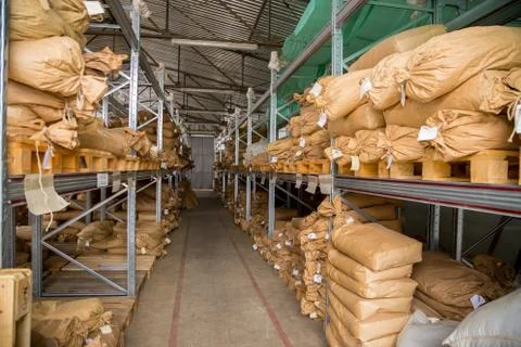 Old paper sacks placed in warehouse stacking before export Stock Photos