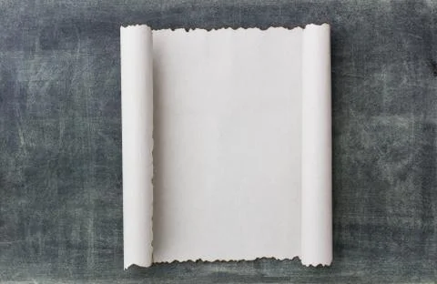 Old paper scroll on a blackbroad Stock Photos