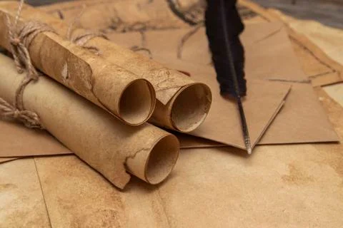 Old paper scrolls, pen for writing. Envelope sealed with a seal and jute crep Stock Photos