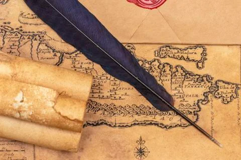 Old paper scrolls, pen for writing. Envelope sealed with a seal and jute crep Stock Photos