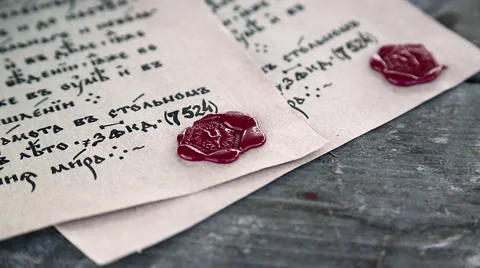 Old papers lies on the table. Antique letters with official heraldic stamps Stock Footage 66687315