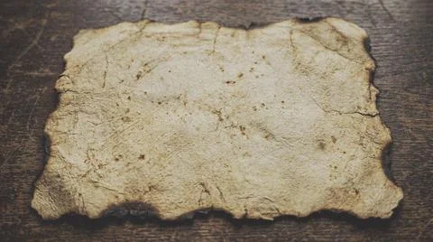 Old Parchment Map with Burned Edges on Textured Background. Fotos Stock